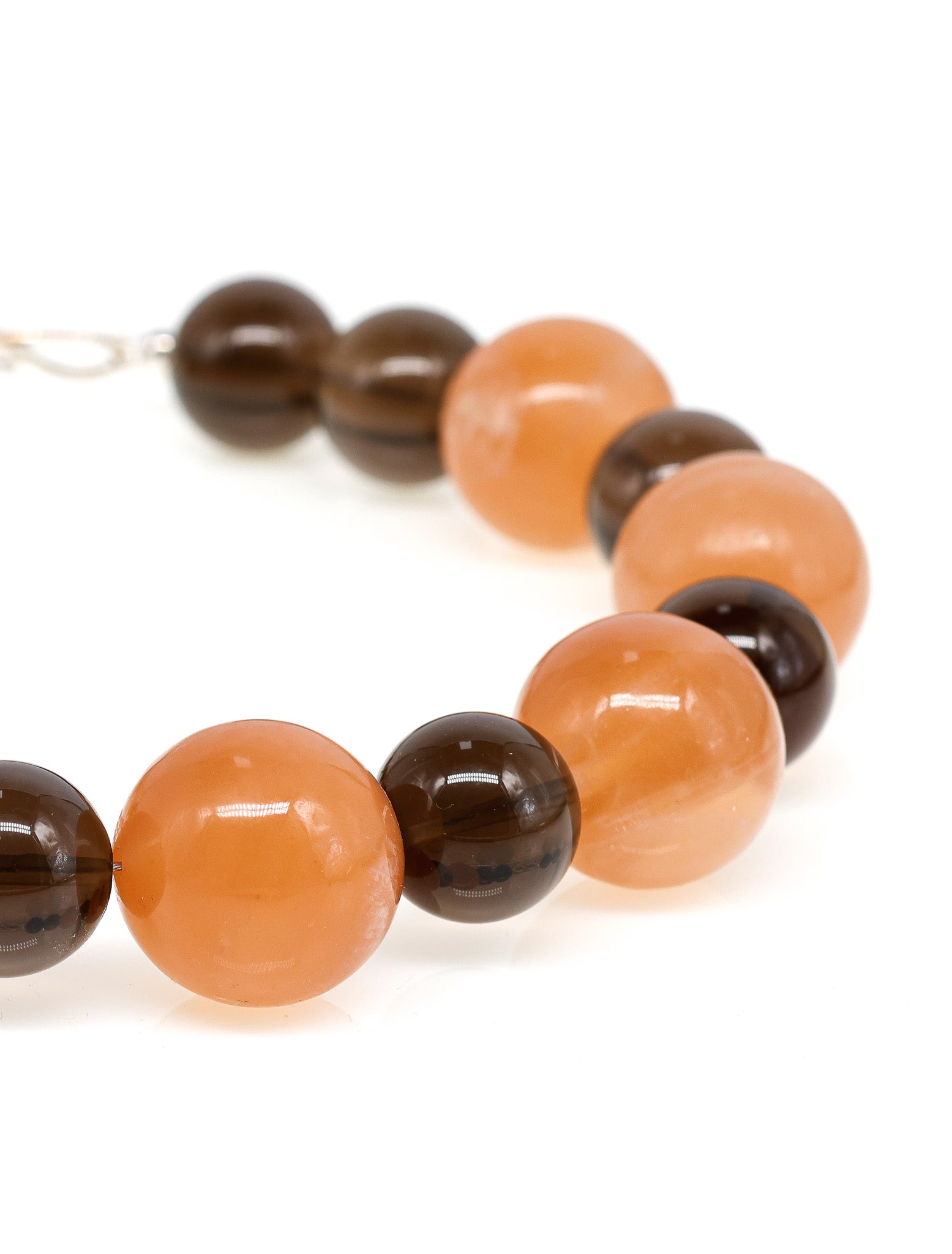 Raha: Orange Calcite, Smoky Quartz